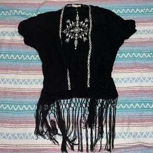 Black swimsuit coverup with white embroidered tribal pattern
